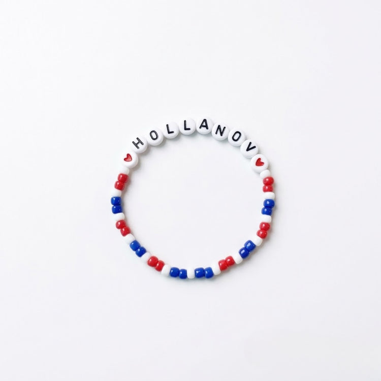 Heated Rivalry "HOLLANOV" Handmade Beaded Friendship Bracelet flat lay product shot – Lizzie & Friends