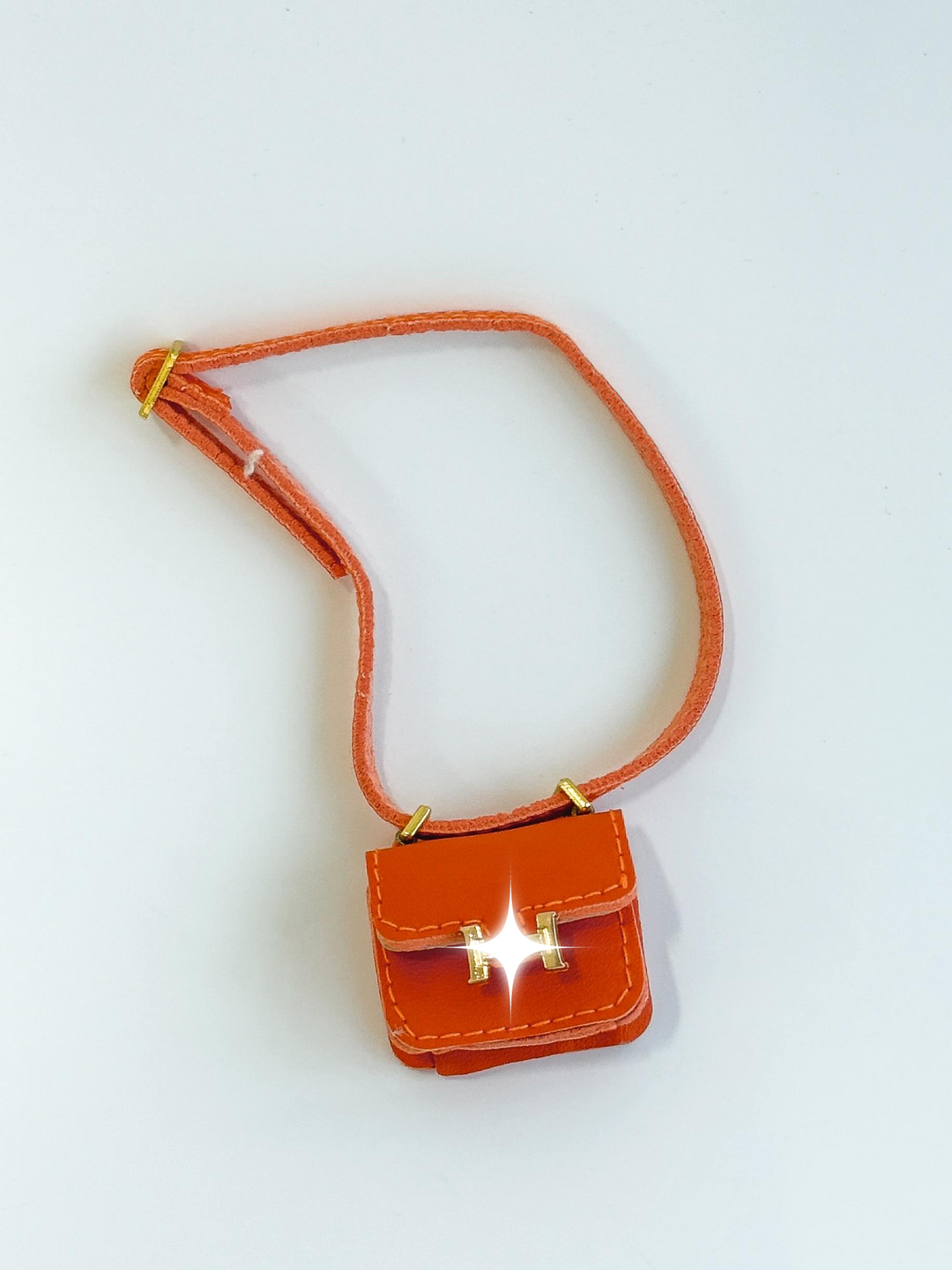 Labubu Mini Orange Crossbody Bag – Gold Accent Edition